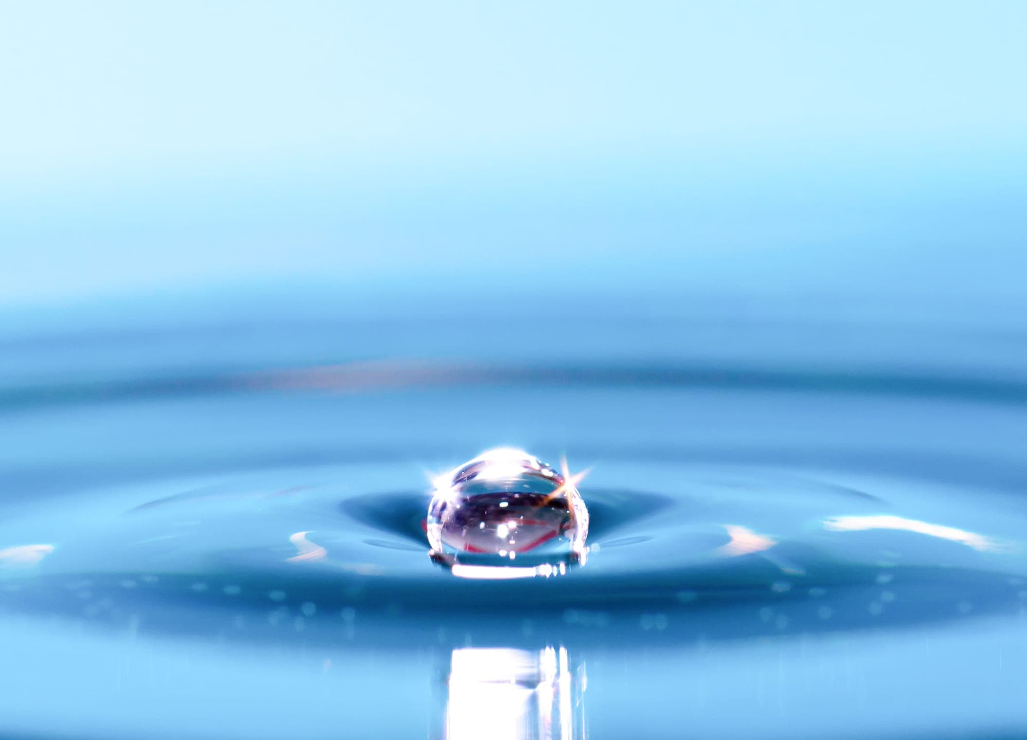 A close-up of a clear water droplet.